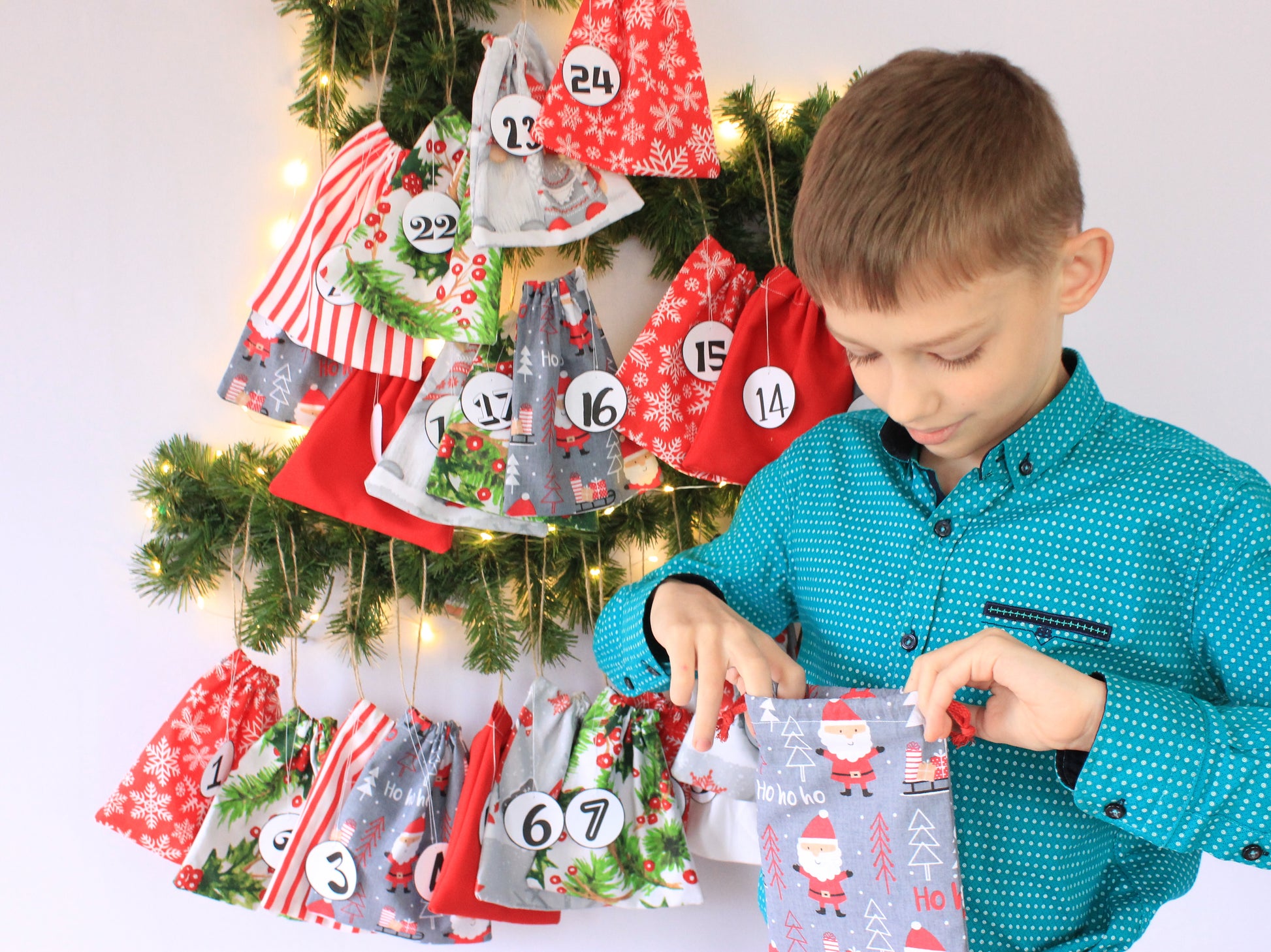 Child looking at a gift in an advent calendar - sewing pattern by NatkoPatterns