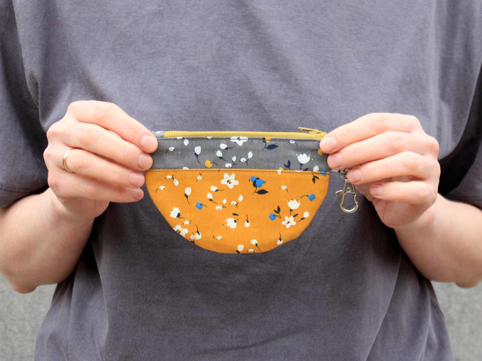 Person holding a small pouch - PDF sewing pattern with template by NatkoPatterns