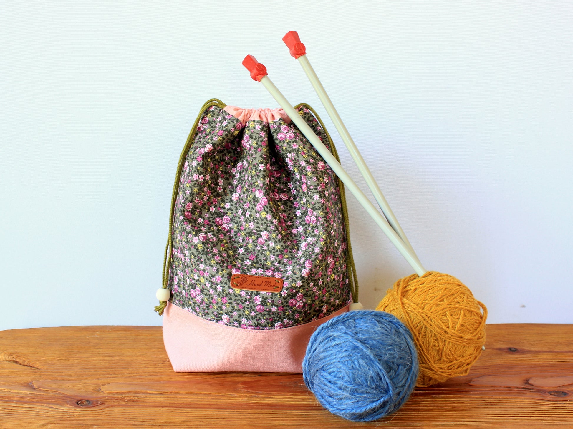 Drawstring bag holding knitting needles and yarn, handmade using sewing pattern by NatkoPatterns
