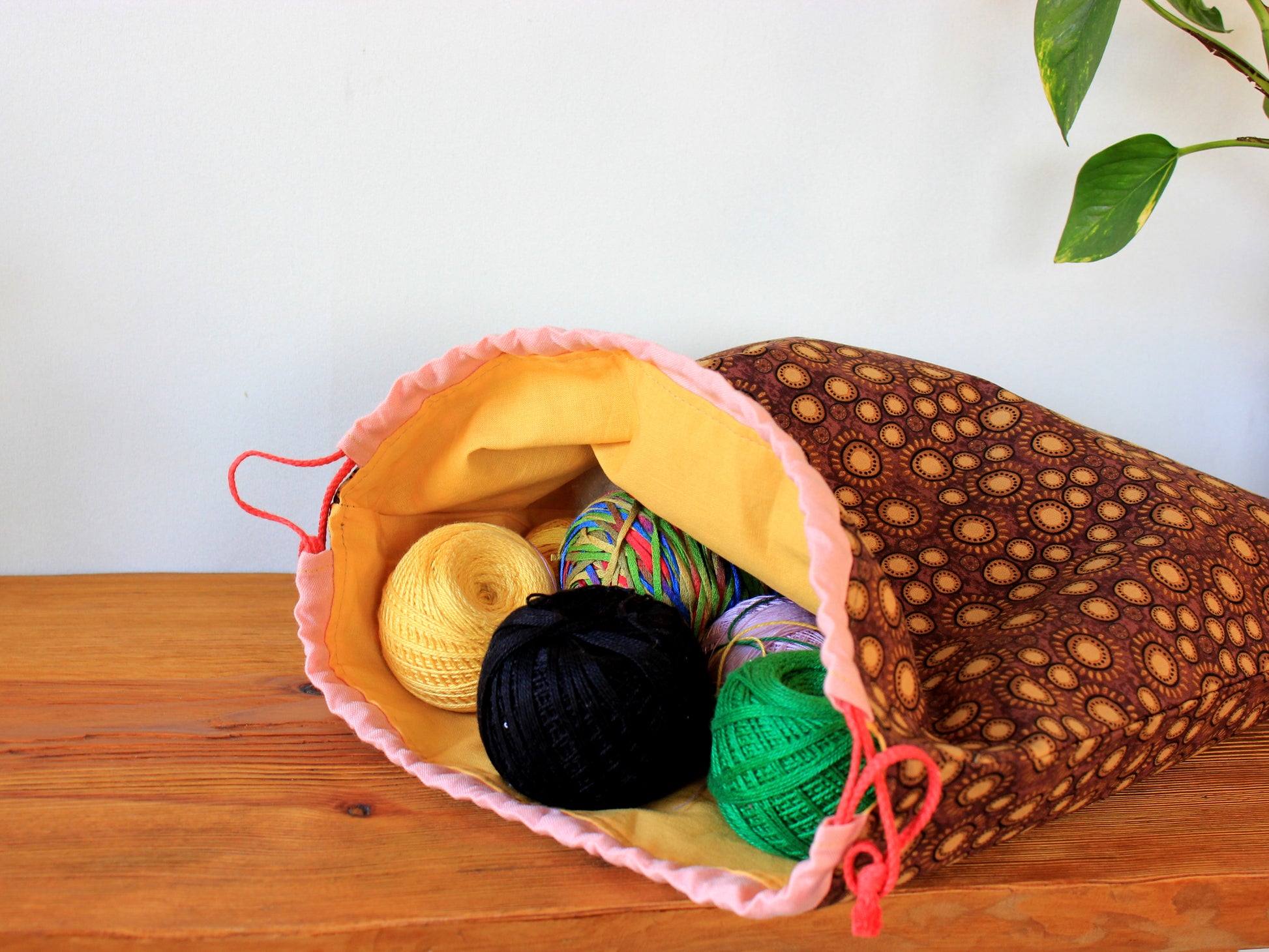 Colorful yarn balls in a drawstring fabric bag - sewing pattern by NatkoPatterns