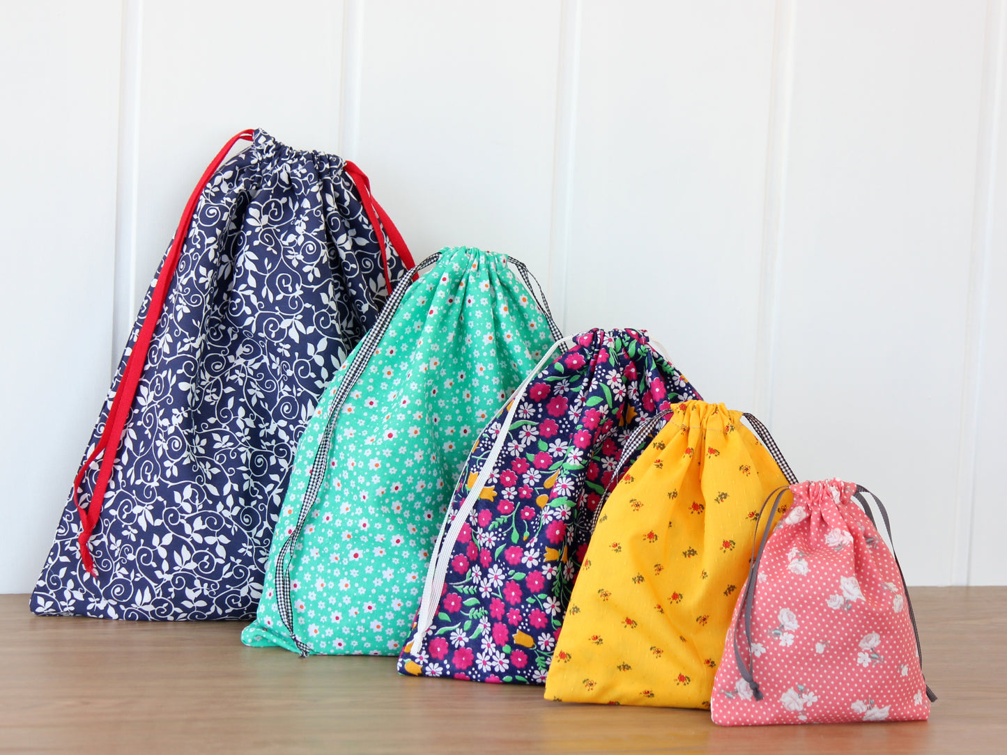 Collection of drawstring bags in various sizes – printable PDF sewing template by NatkoPatterns