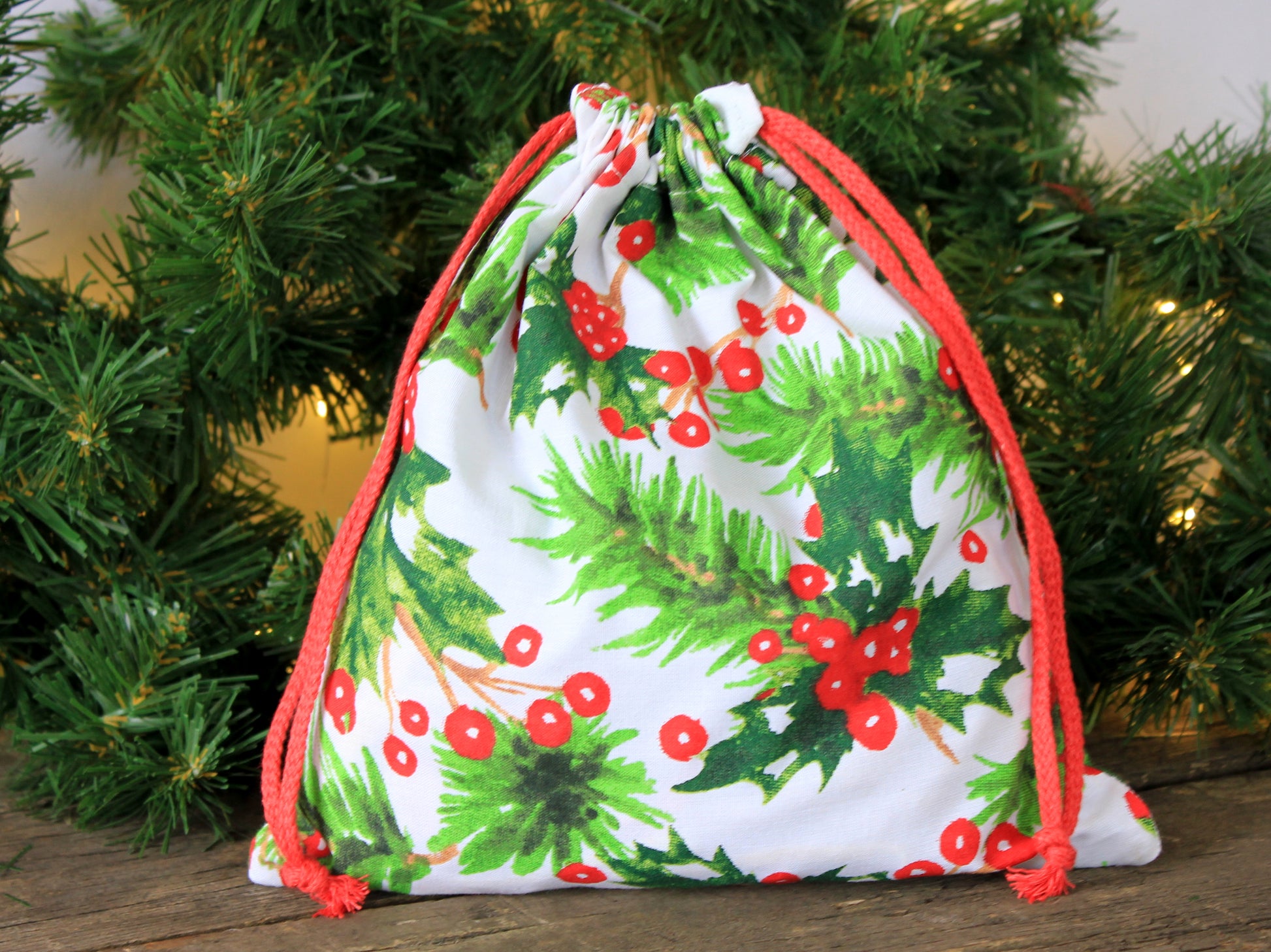 Holiday fabric gift bag filled with gifts– eco-friendly alternative to wrapping paper