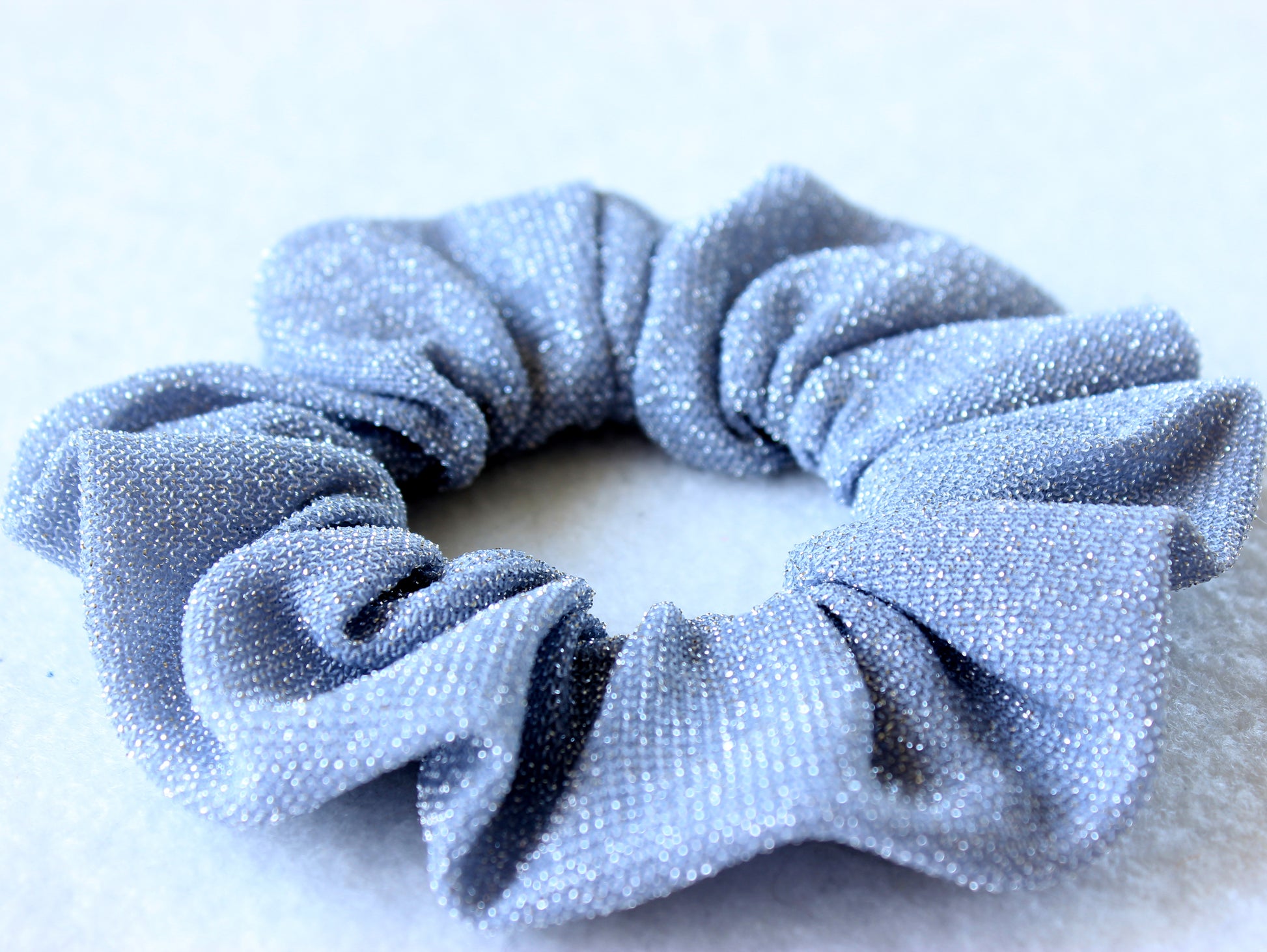 Silver glittery scrunchie made with sewing pattern by NatkoPatterns