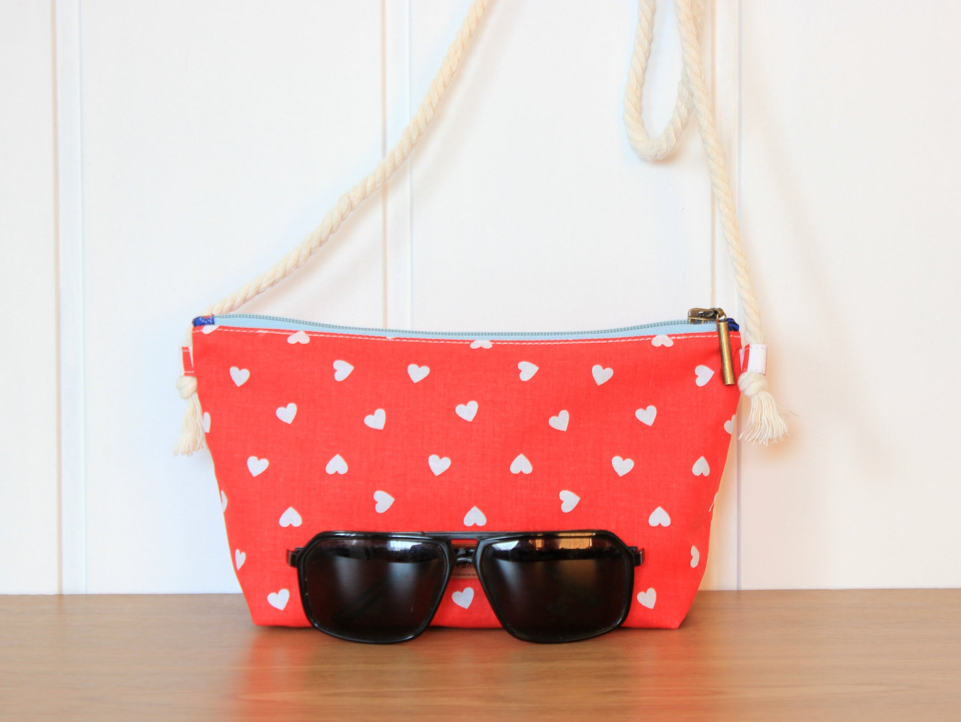Red pouch with white heart pattern and sunglasses - pattern from NatkoPatterns