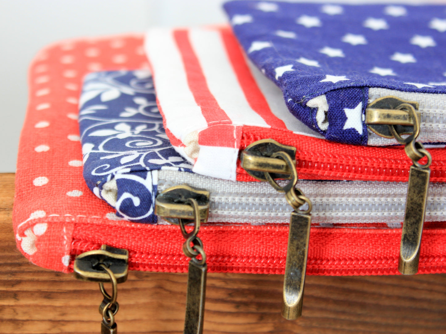 Stack of fabric pouches with zippers - easy sewing pattern by NatkoPatterns