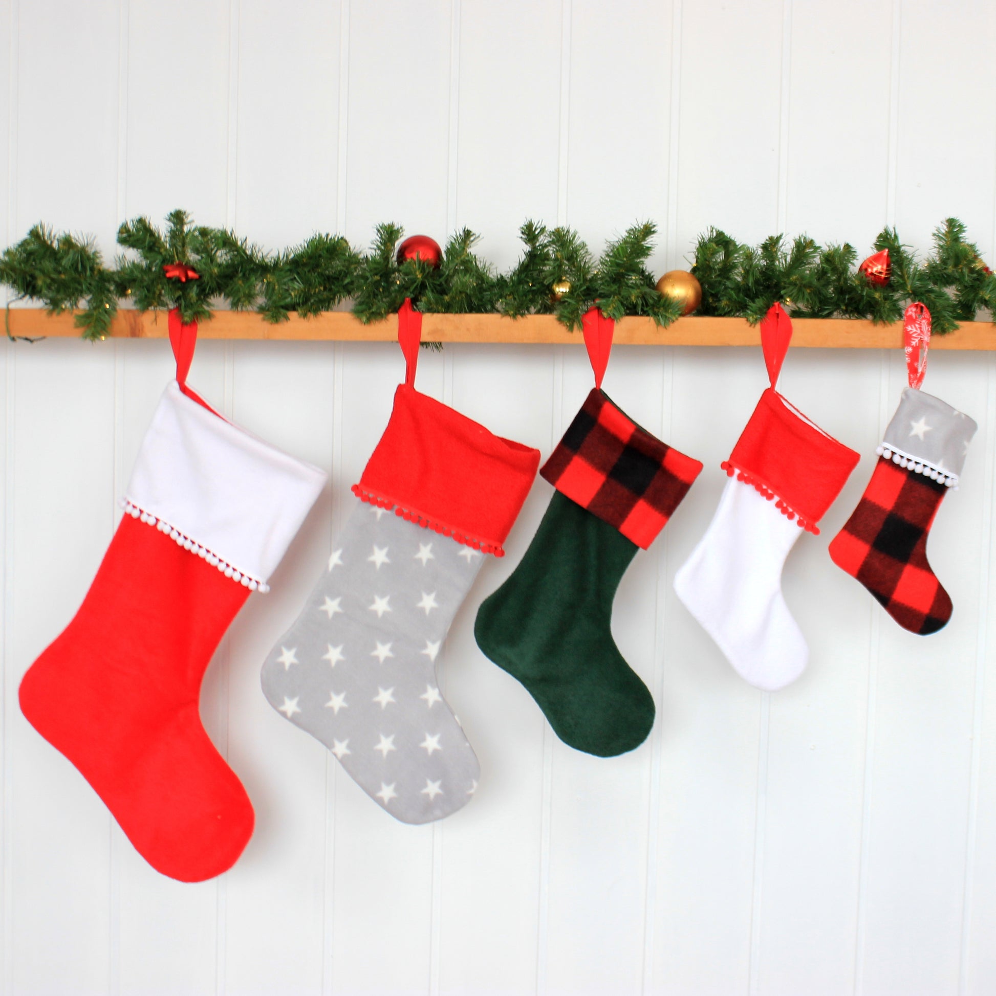 Five colorful Christmas stockings sewing tutorial with templates by NatkoPatterns