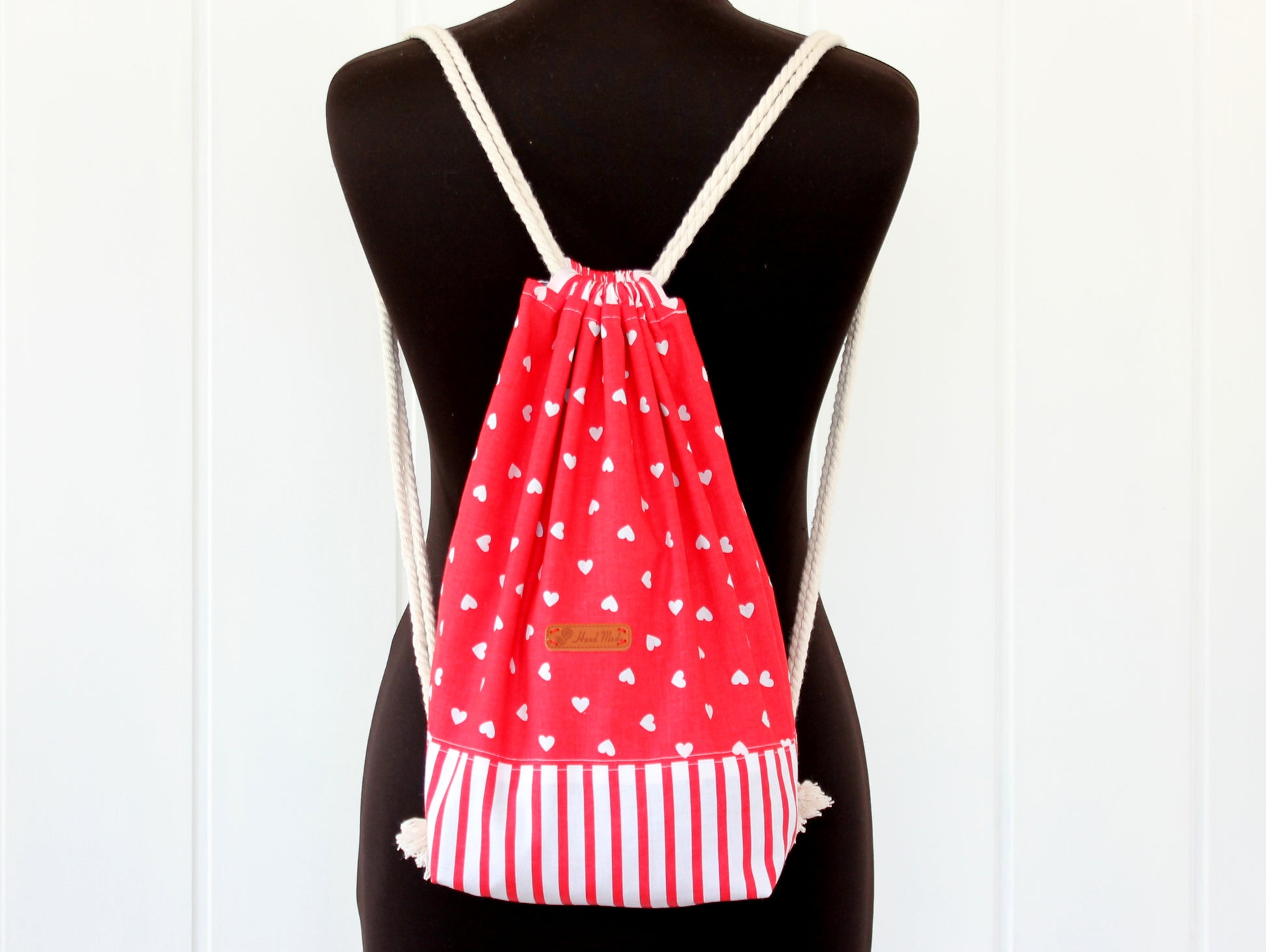 Drawstring backpack on a mannequin, easy sewing pattern
