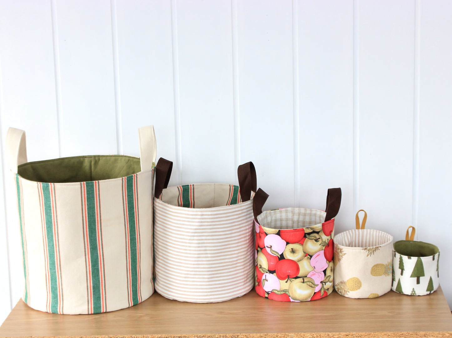 Reversible fabric storage baskets made with the NatkoPatterns Round Fabric Basket sewing pattern