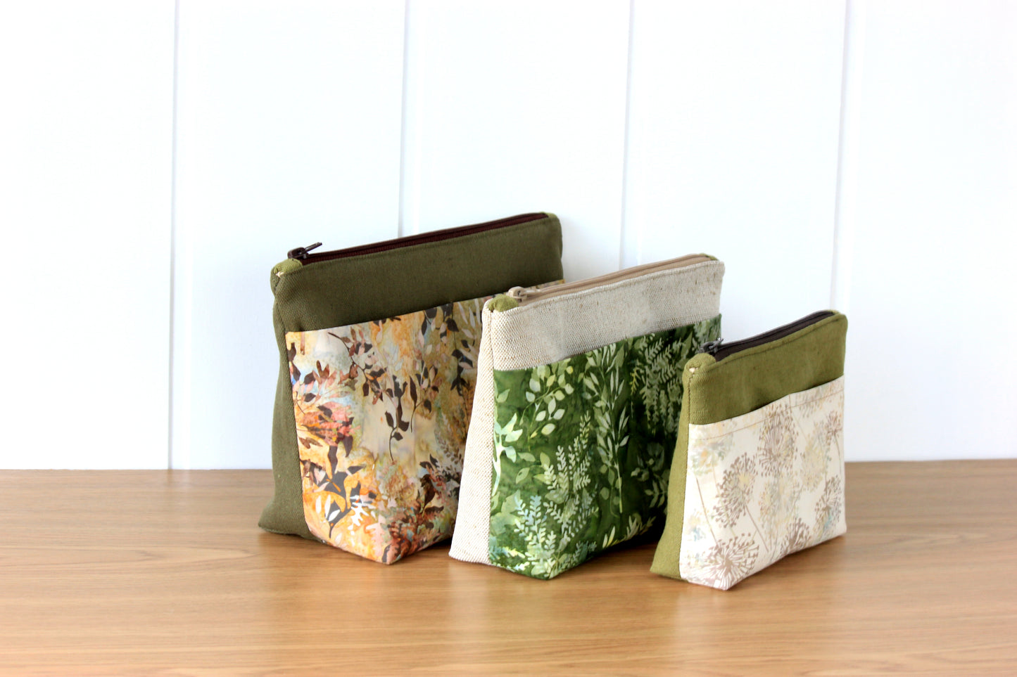 Handmade cosmetic pouch sewing pattern with zipper and pockets for travel organization